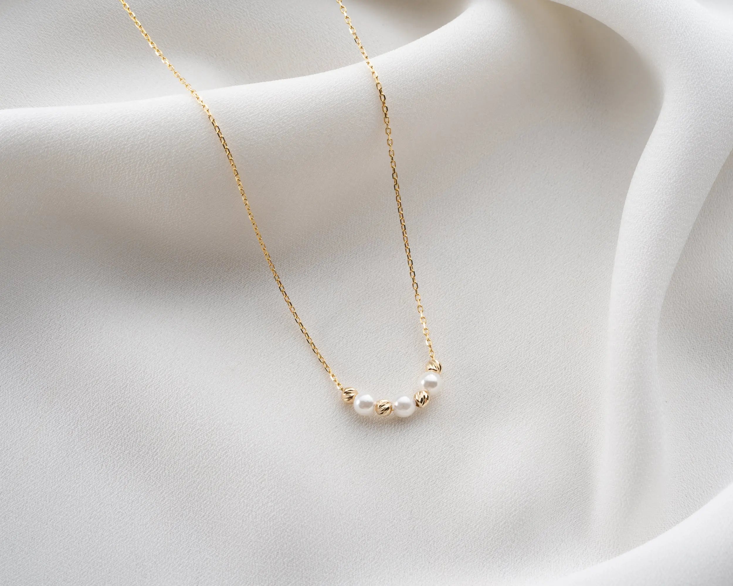 elegant pearl and gold bead necklace
