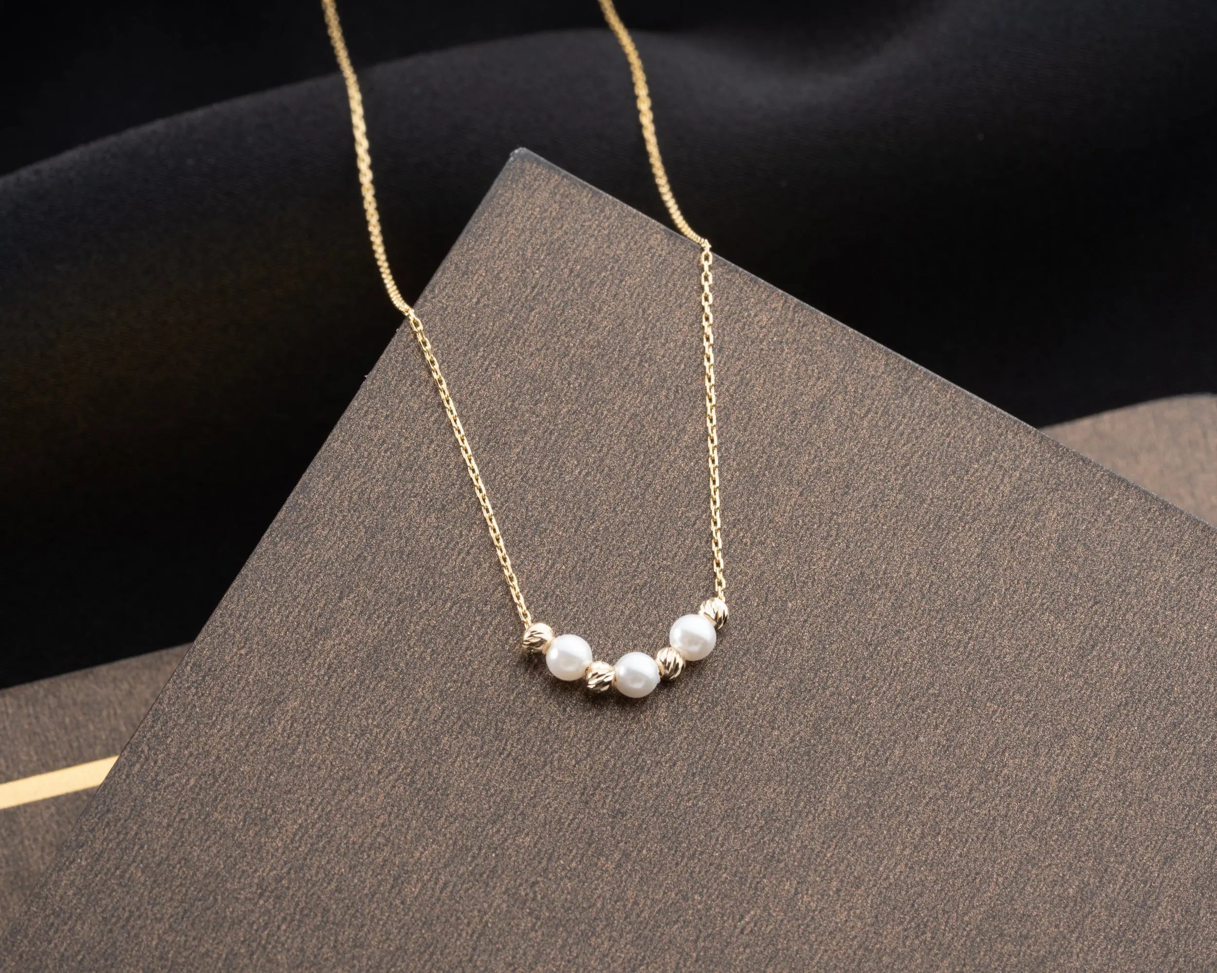 elegant pearl and gold bead necklace