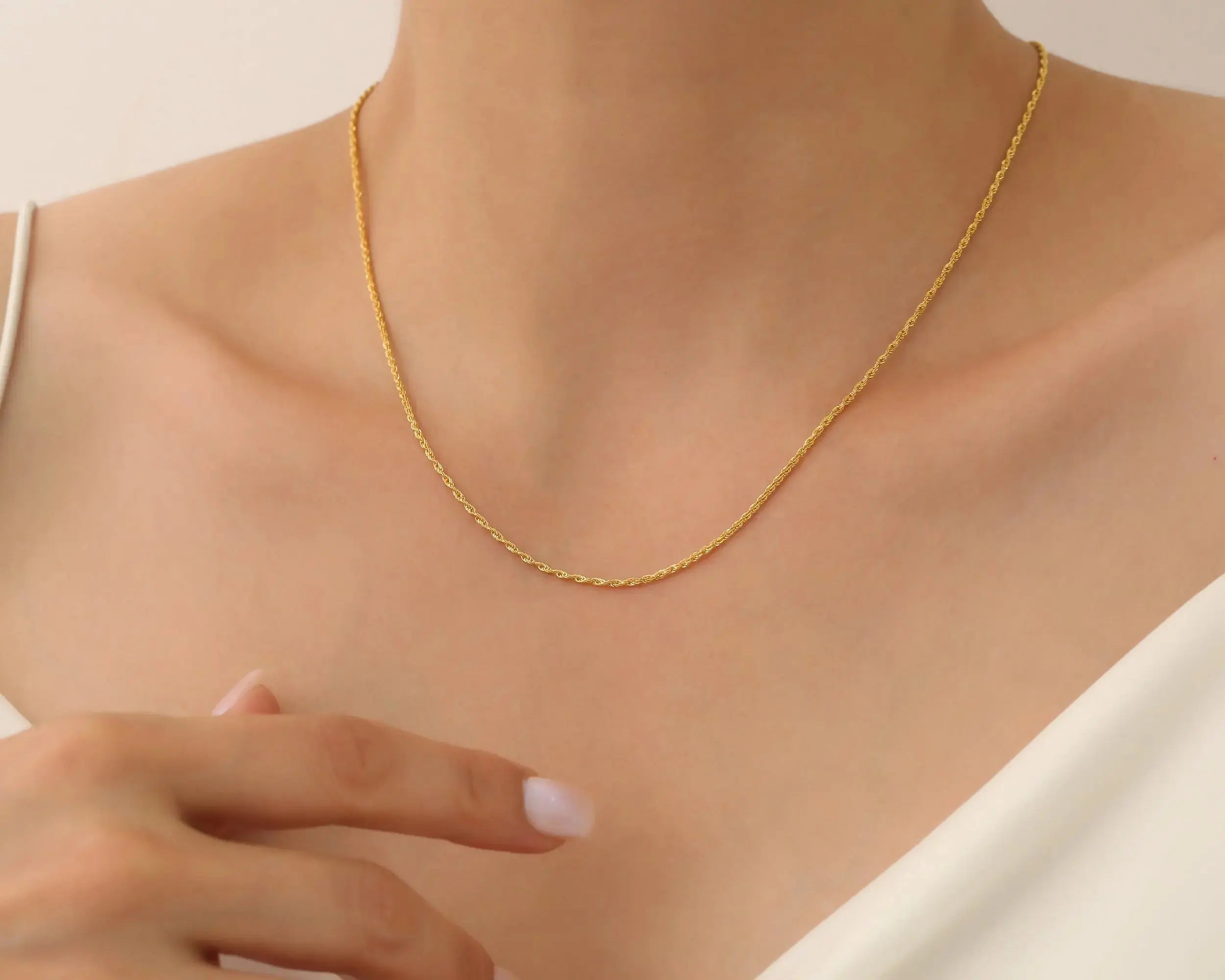 a young lady wearing 14K Gold Chain Necklace