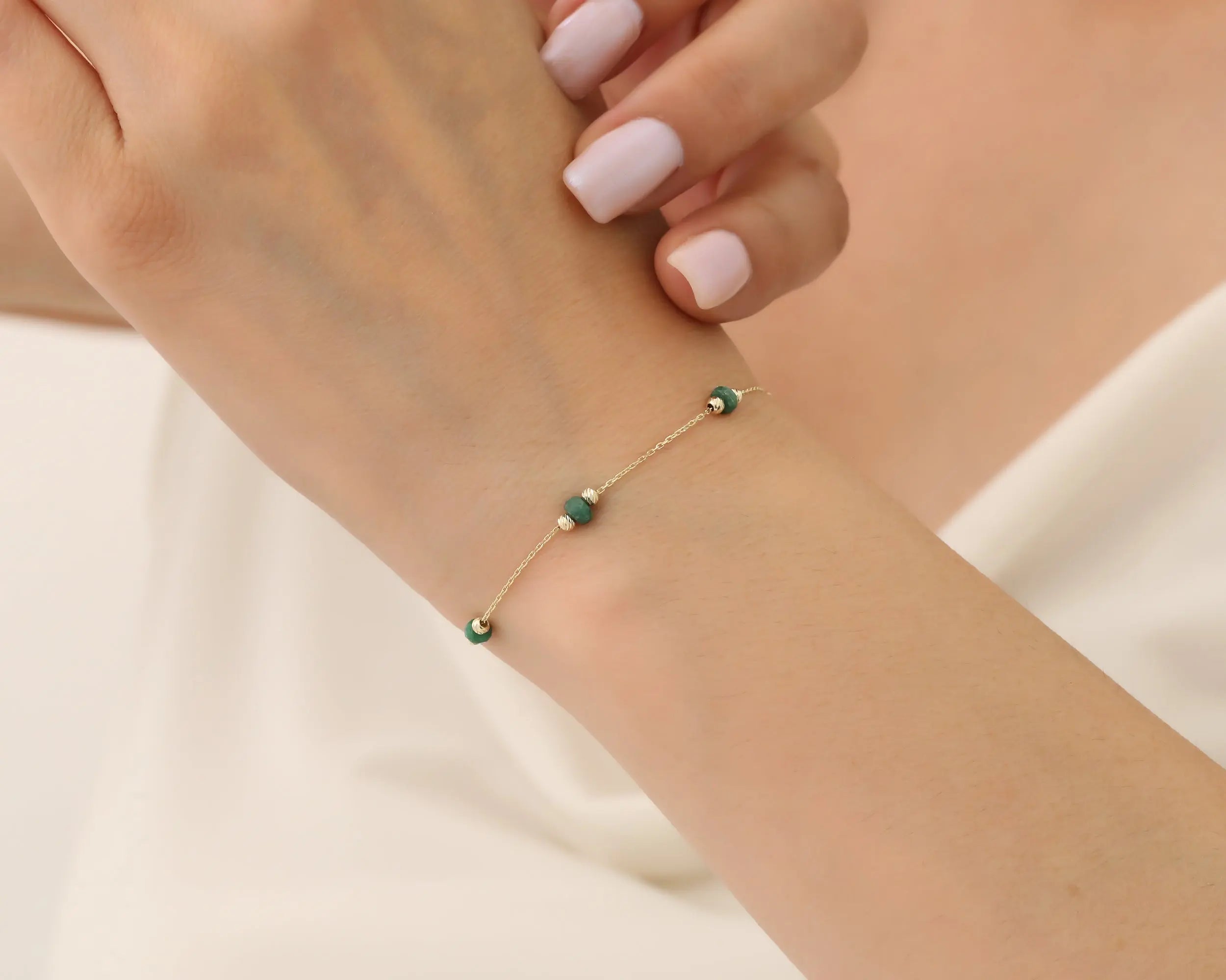 Gold lady wearing Beaded Bracelet