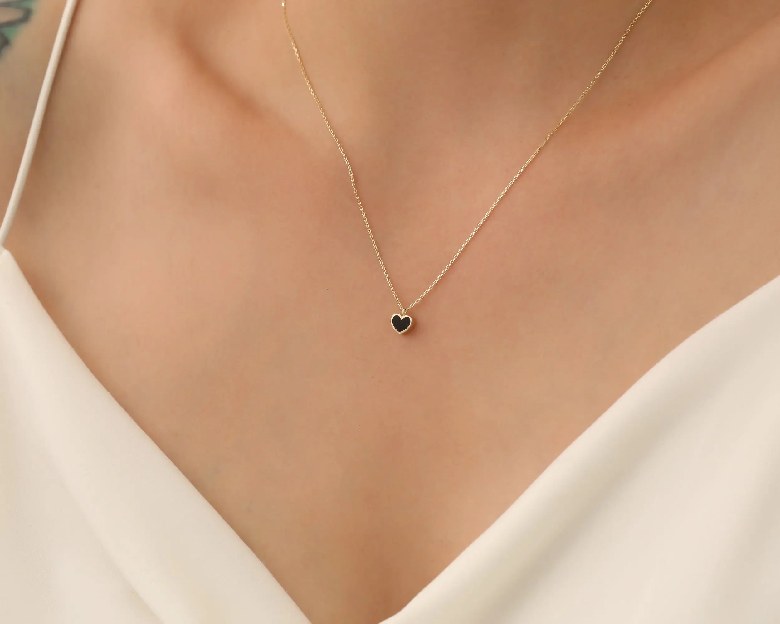 a young lady with Gold Minimalist Enamel Heart Necklace