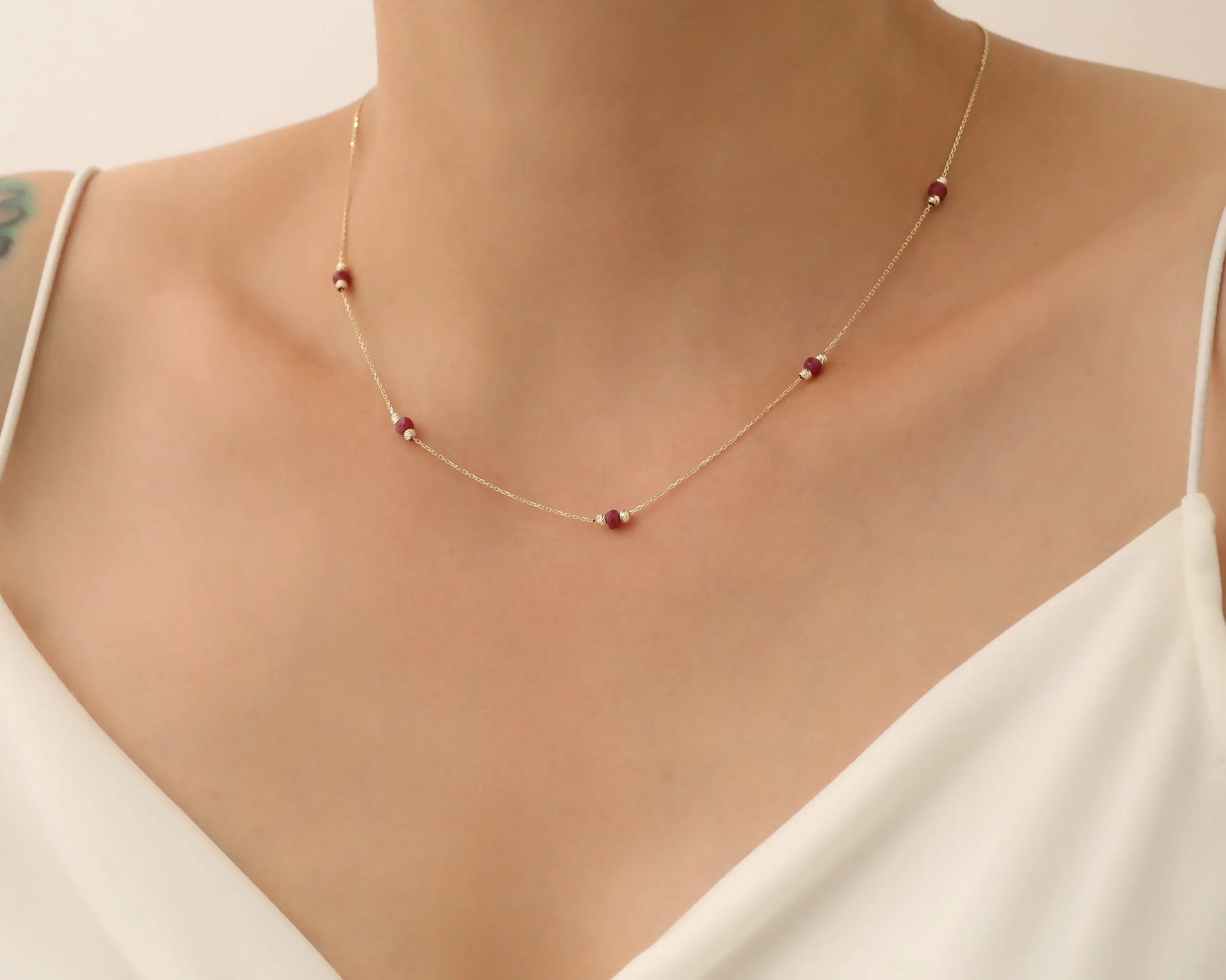 a lady wearing 14K Solid gold Beaded Necklace