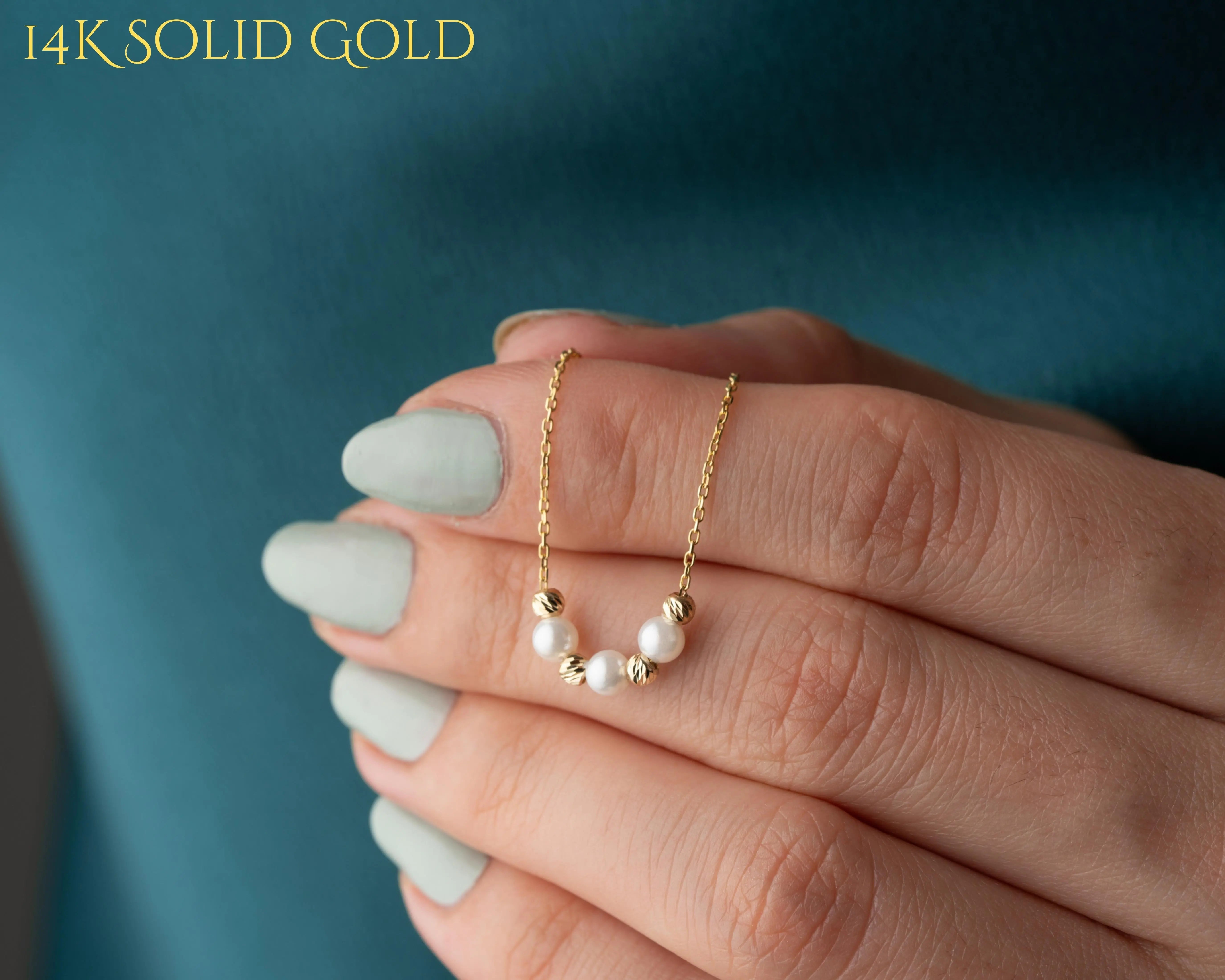 elegant pearl and gold bead necklace